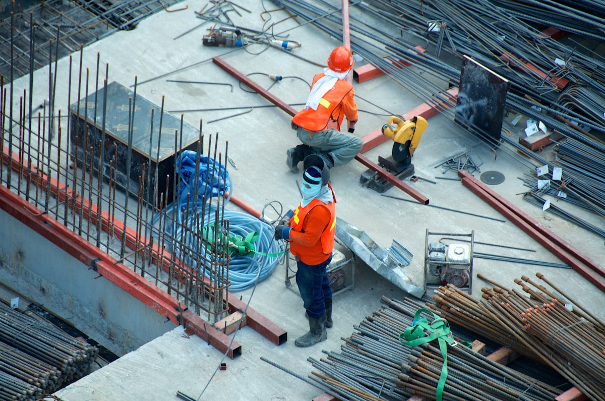 Aerial view of roofing crew working on a flat roof